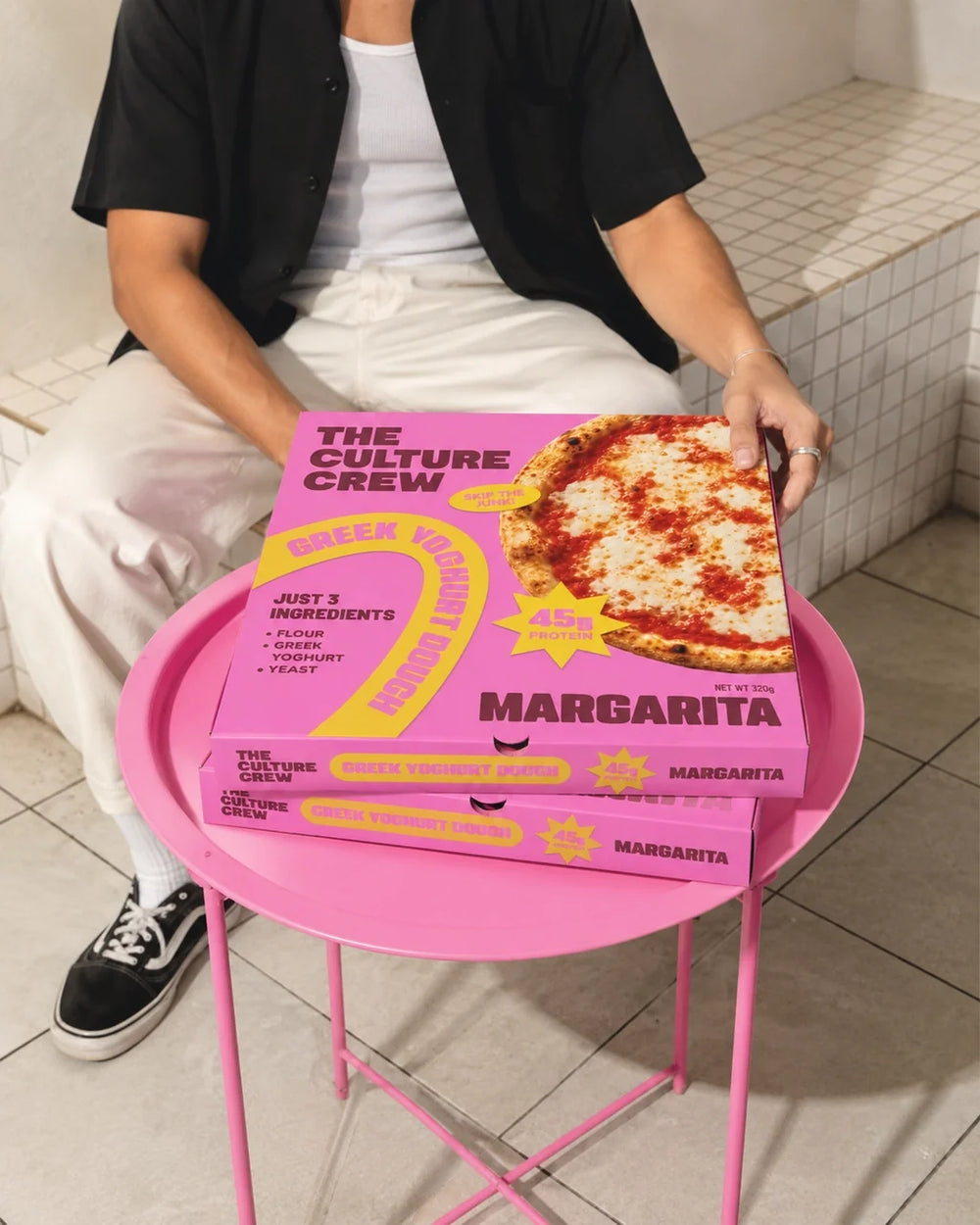 Two Margarita packs on a pink tray table